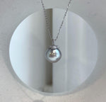 Lustrous pearl pendant with a playful persimmon-inspired design.