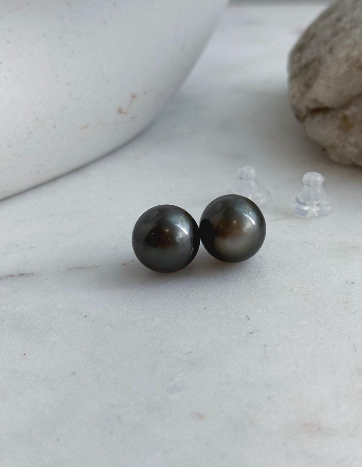 Platinum gray pearl studs featuring reflective luster and simple S925 silver settings.