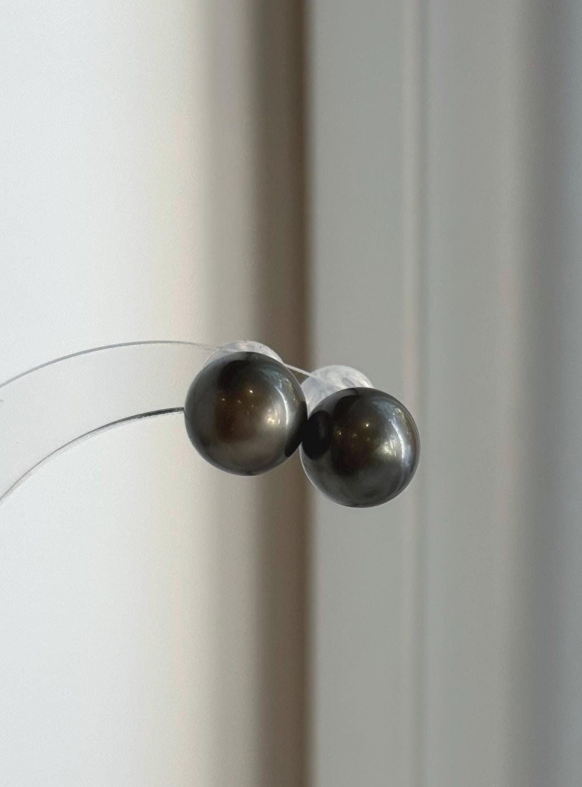 Genuine saltwater Tahitian pearl earrings in a minimalist sterling silver stud design.