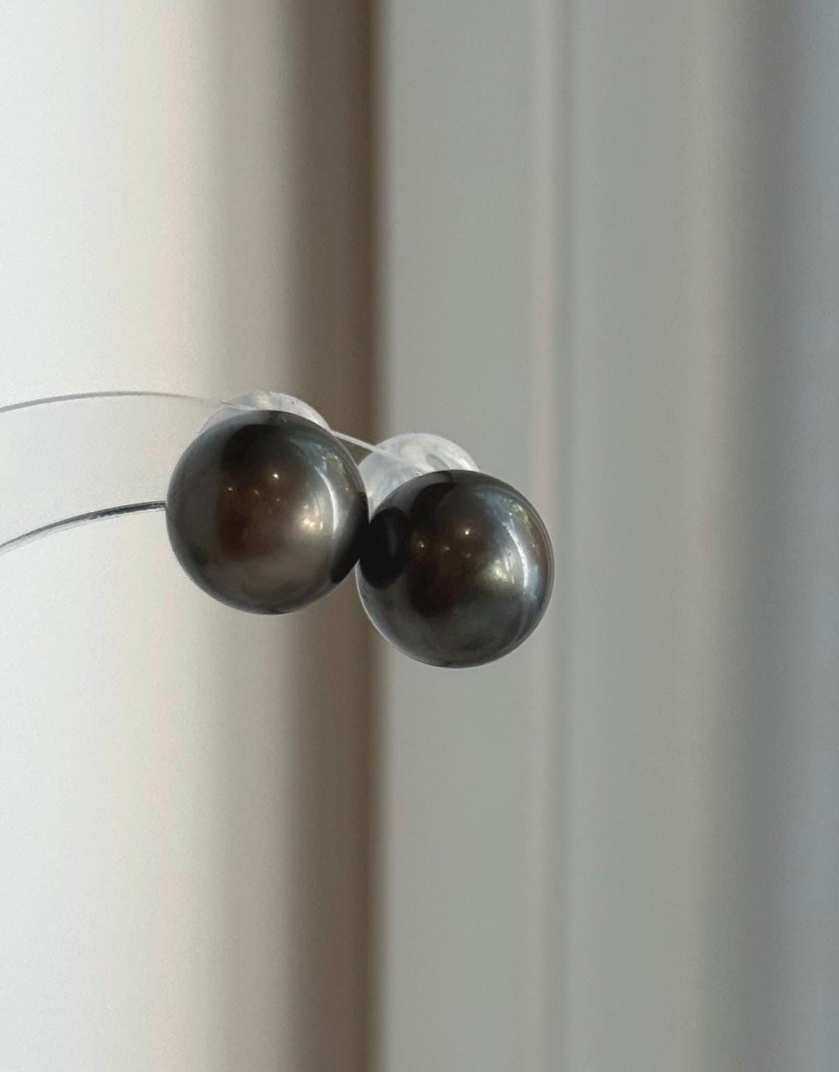 Platinum gray Tahitian pearls set in classic sterling silver stud earrings.