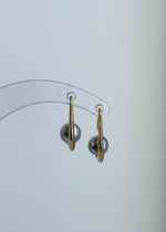 Silver blue pearl drop earrings featuring reflective luster and S925 sterling silver hooks.