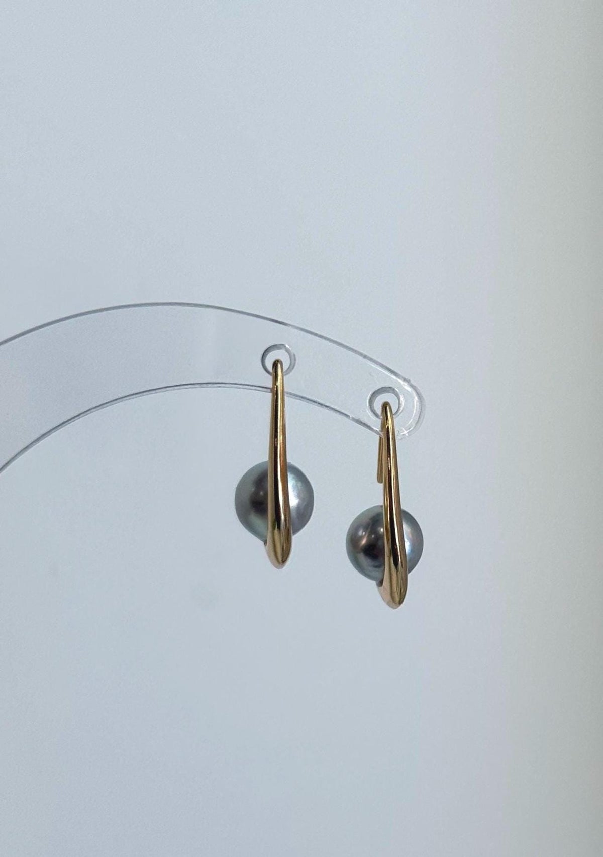 Lustrous silver blue Akoya pearls in a simple sterling silver drop earring design.