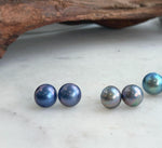 Genuine saltwater Mabe pearl earrings with mirror luster and iridescent tones.