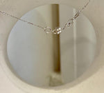 Hunter green saltwater pearl pendant with a silver setting.