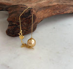 Golden South Sea pearl bracelet with heart charm.
