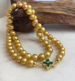 Hand-knotted necklace with genuine golden freshwater pearls.