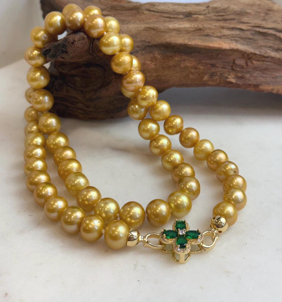 Hand-knotted Edison necklace with radiant golden pearls.