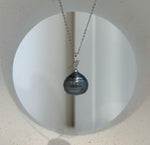 Genuine saltwater pearl pendant with a platinum-colored sheen.