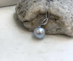 Silver pearl necklace with a simple sterling silver pendant.