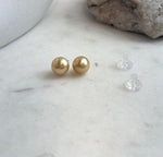 Rich tea gold saltwater pearls set in sterling silver studs.