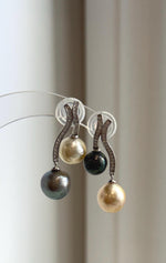 Double pearl drops with crystal-accented S925 silver settings.