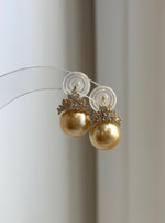 Golden South Sea pearl crown stud earrings with sparkling crystal accents.
