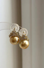 Golden South Sea pearls paired with sparkling crystals.