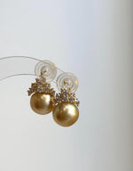 Golden South Sea pearls paired with sparkling crystals.