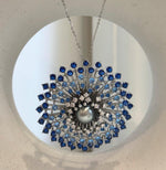 Tahitian pearl jewelry with light blue, dark blue, and clear stone accents.