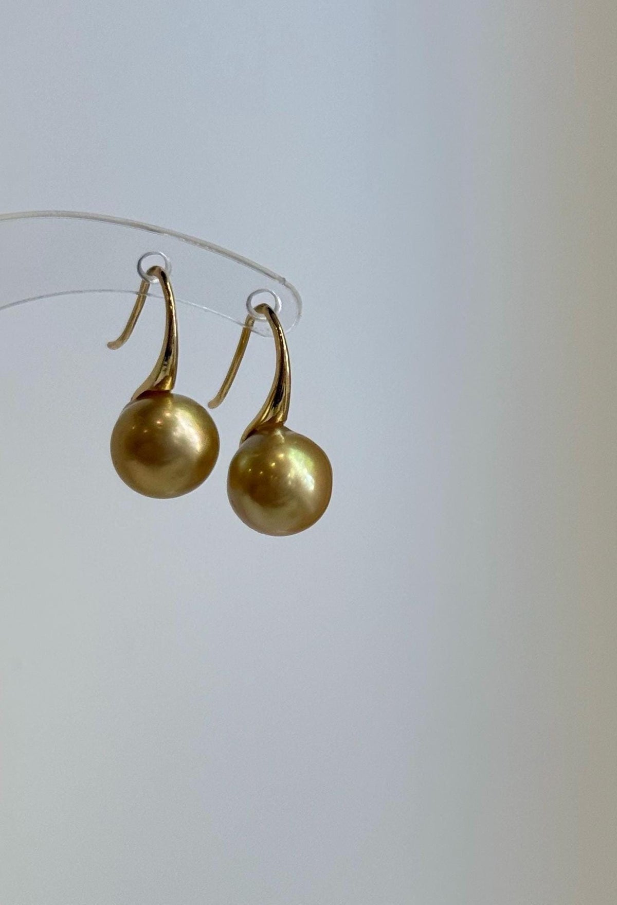 Lustrous golden saltwater pearls on S925 silver high heel hooks.
