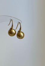 Lustrous golden saltwater pearls on S925 silver high heel hooks.