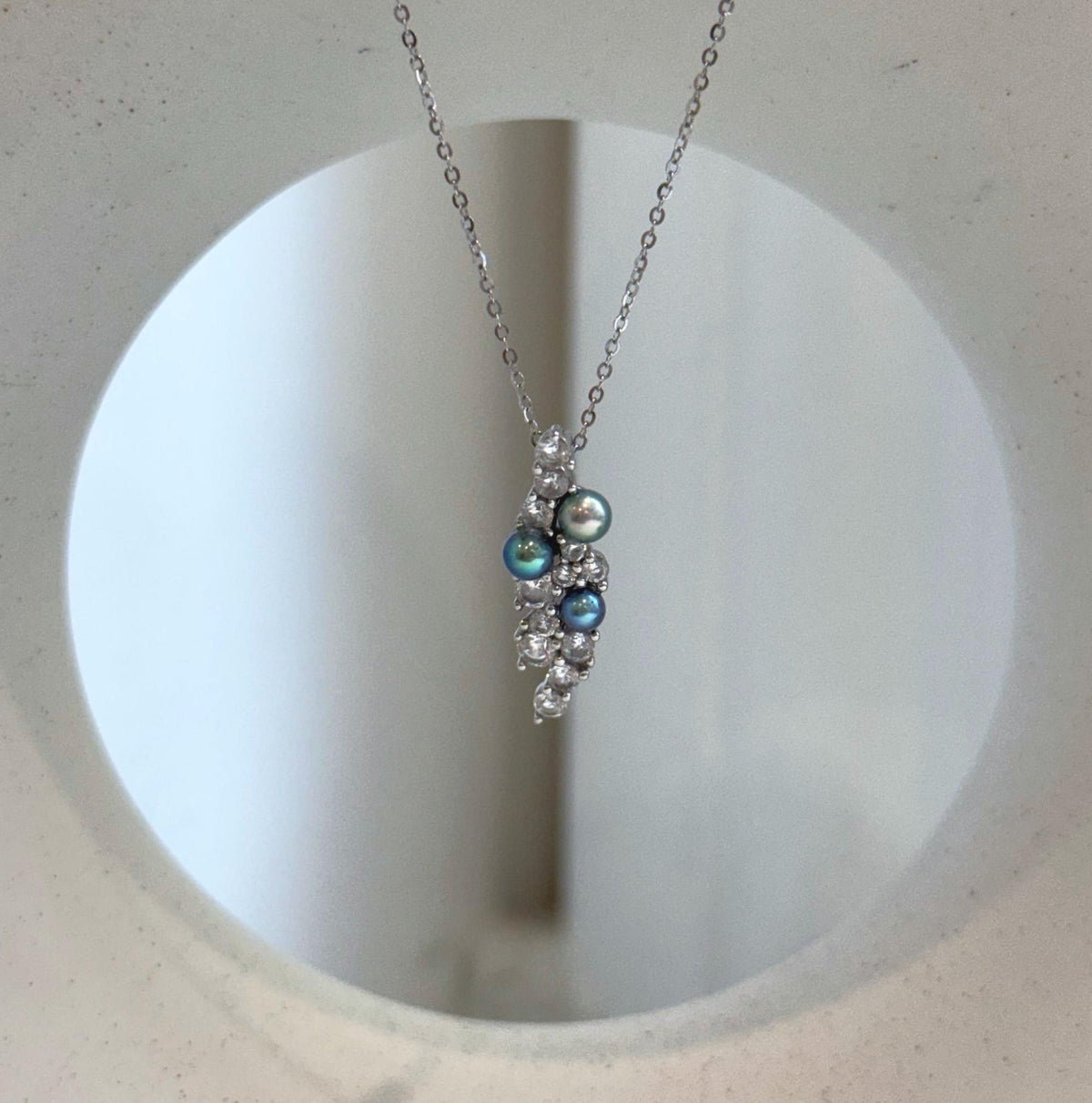 Peacock freshwater pearl leaf pendant in sterling silver
