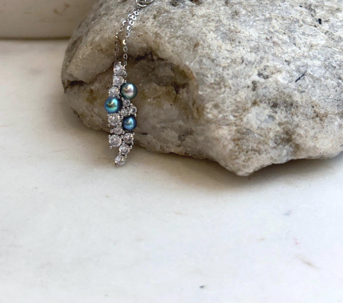 Iridescent freshwater pearls in a sterling silver leaf setting