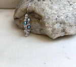 Iridescent freshwater pearls in a sterling silver leaf setting