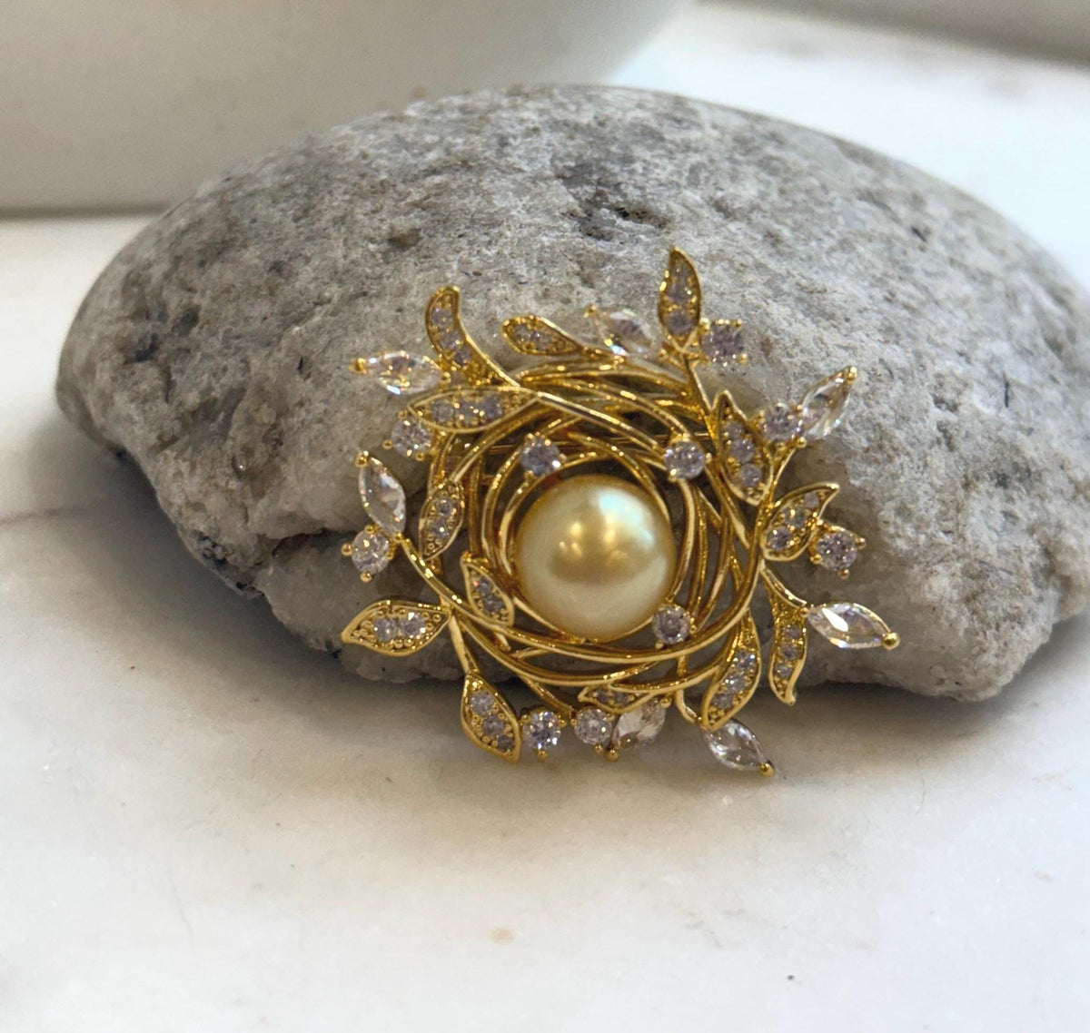 Golden South Sea pearl brooch with a sparkling leaf wreath
