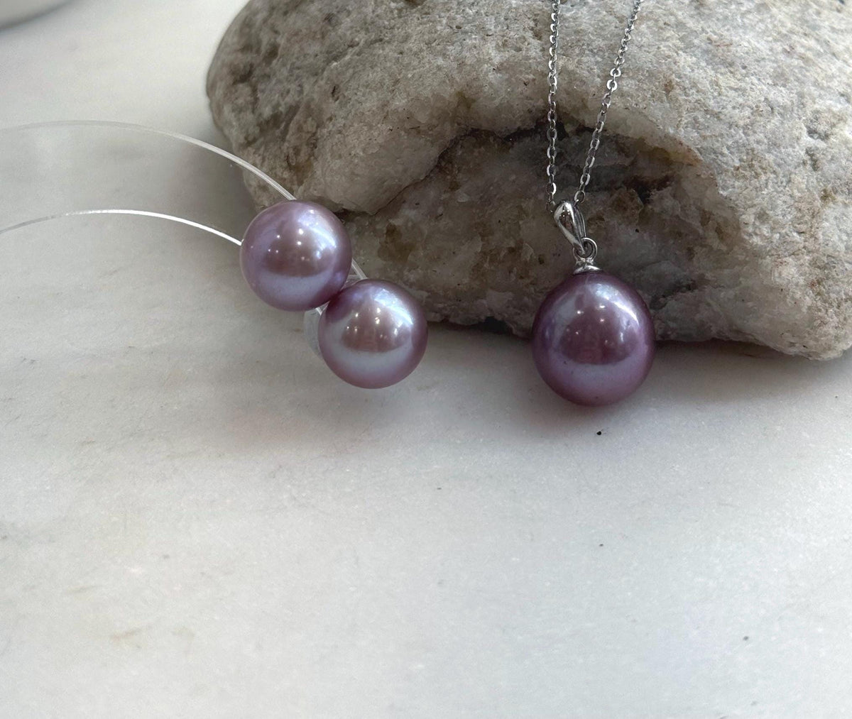 Purple Edison pearl pendant with a polished silver bail.