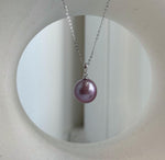 Rose lavender pearl studs shown with sterling silver posts.
