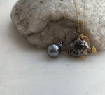 Anglerfish pendant with a lustrous gray Tahitian pearl lure.