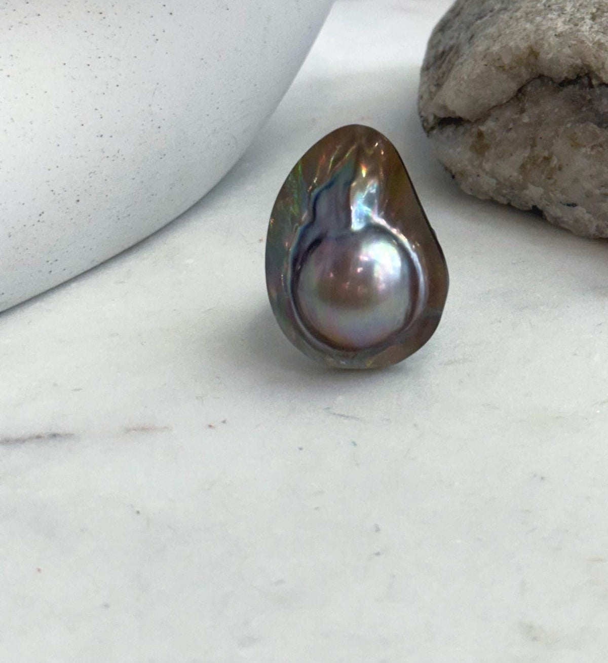 Genuine saltwater mabe pearl ring with extreme luster.