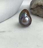Genuine saltwater mabe pearl ring with extreme luster.