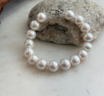 Genuine freshwater pearl bracelet featuring luminous white Edison pearls.