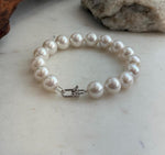 White pearl bracelet with sixteen Edison pearls and a sterling silver clasp.