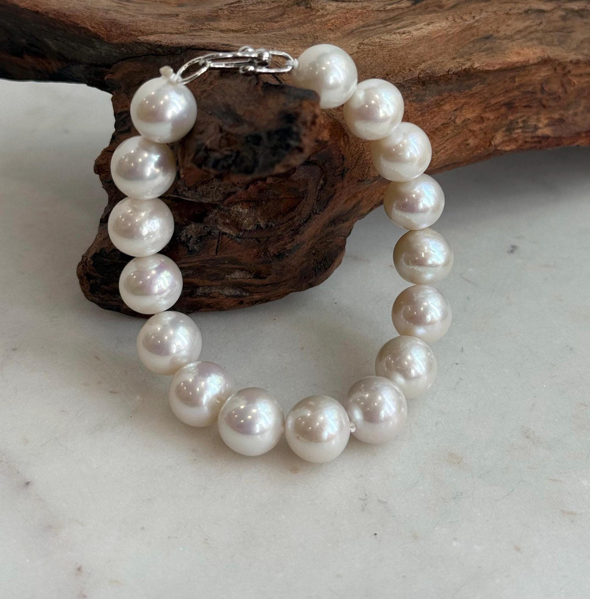 Genuine white Edison pearls paired with a sterling silver bracelet clasp.