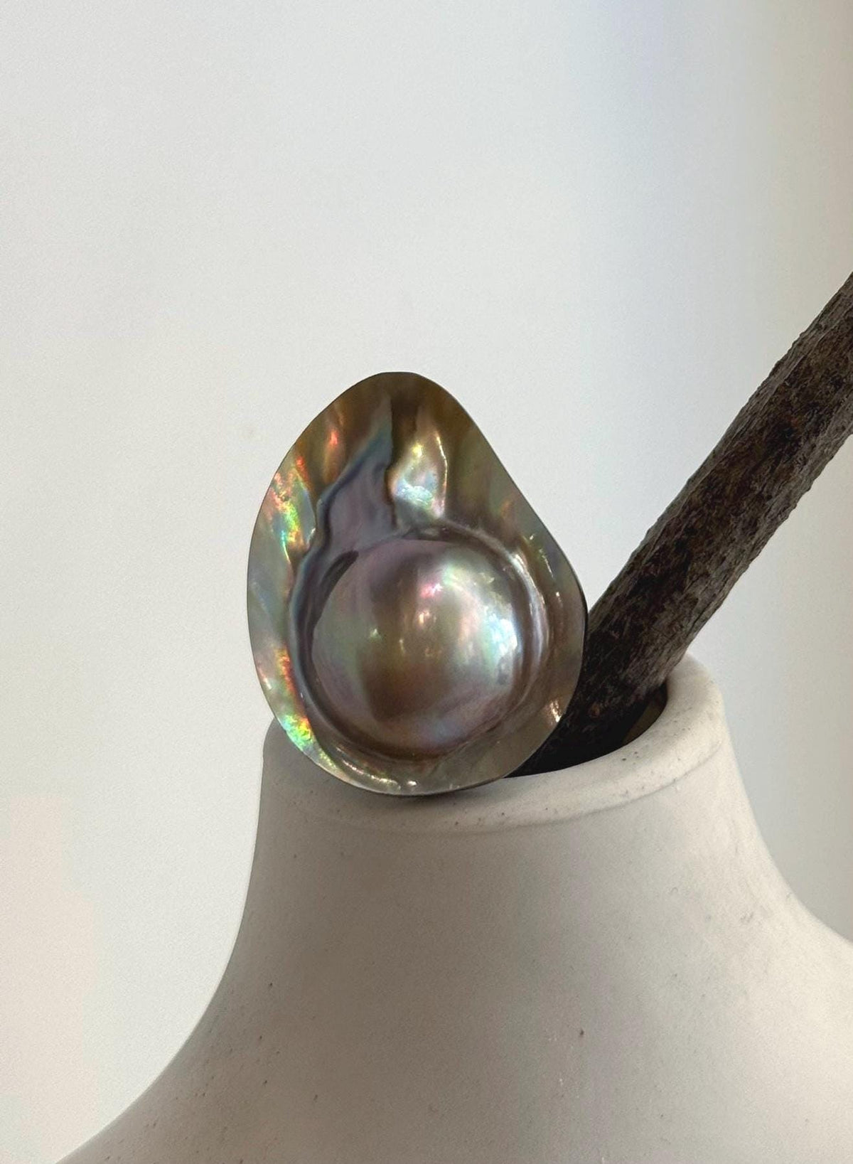 Iridescent ocean mabe pearl statement ring.
