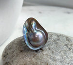 Rainbow iridescence on a genuine saltwater mabe pearl ring.