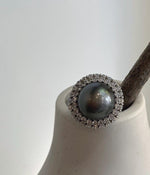 Adjustable sterling silver sunflower ring with a Tahitian pearl.