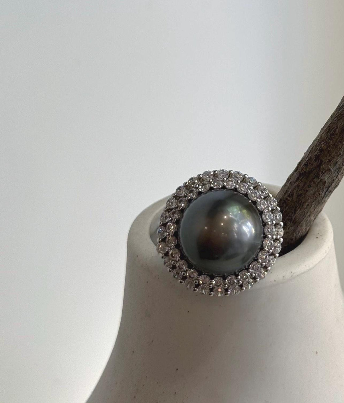 Adjustable sterling silver sunflower ring with a Tahitian pearl.