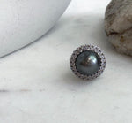 Platinum-toned ocean pearl in a silver sunflower ring.