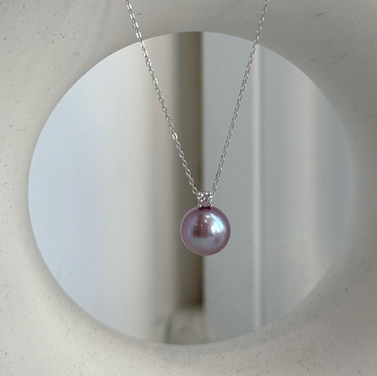 Rose lavender pearls with a smooth surface and mirror shine.
