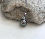 Crystal-accented Tahitian pearl necklace with rich peacock green coloring.