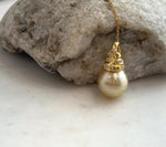 South Sea pearl pendant featuring a deep golden tone.