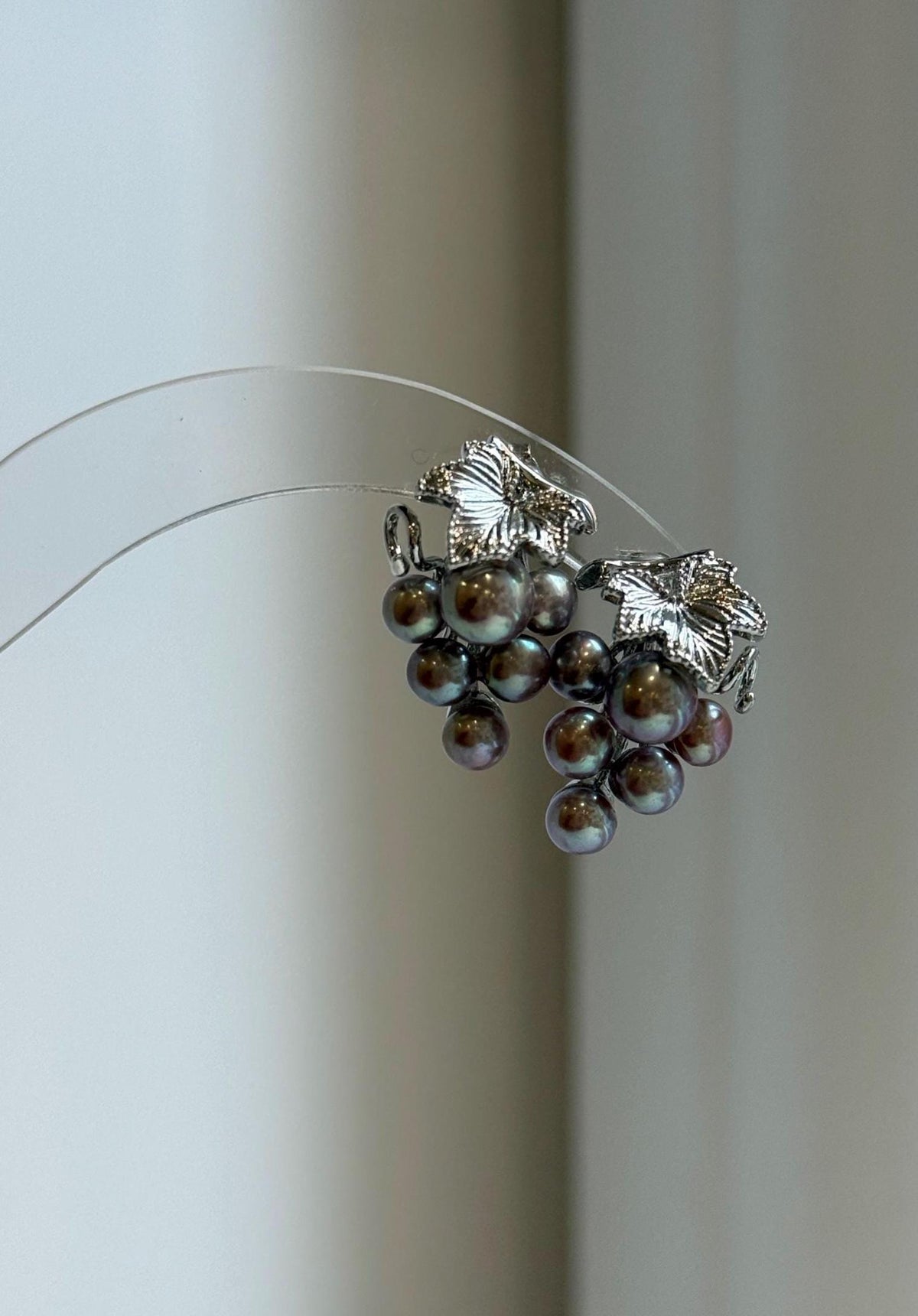 Grape-inspired earrings featuring genuine purple and green keshi pearls.