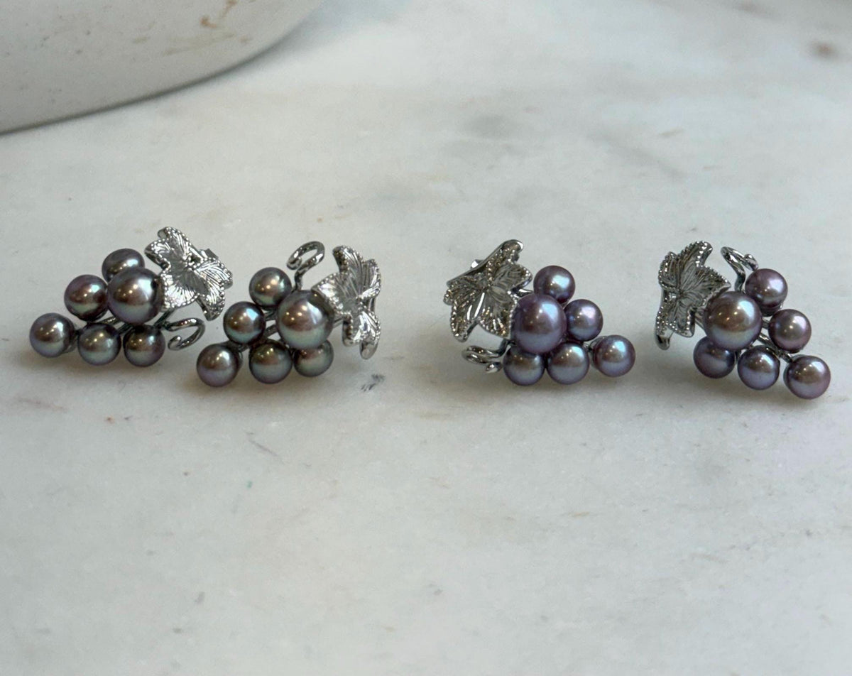 Colorful keshi pearl clusters forming a grape-inspired earring design.