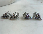Colorful keshi pearl clusters forming a grape-inspired earring design.