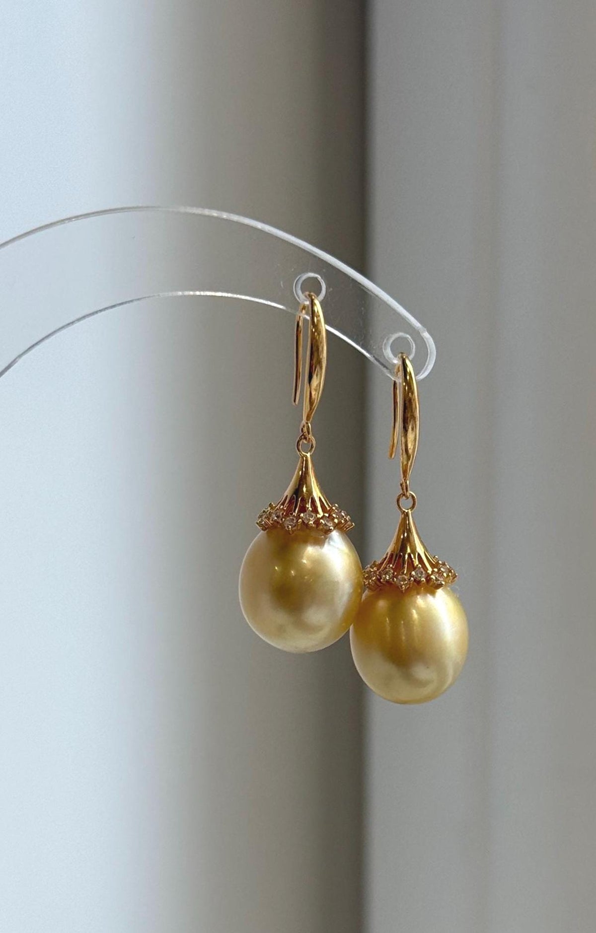 Rich golden pearls with bright reflections in S925 sterling silver drop settings.