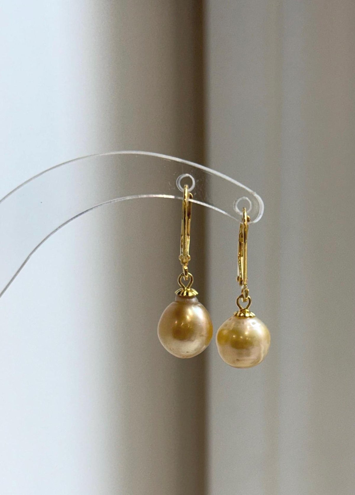 S925 sterling silver drop earrings featuring warm champagne gold pearls.