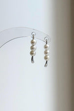 Lustrous white pearls paired with sleek S925 sterling silver curves.