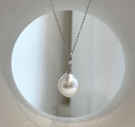 Large ocean pearl pendant with radiant luster.