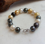 Multicolor ocean pearls joined by an S925 silver clasp.