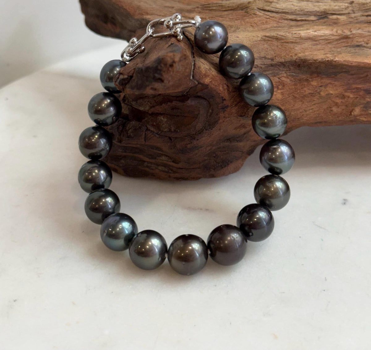 Tahitian pearl bracelet featuring green and silvery hues.